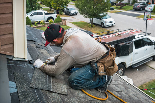 Professional Roof Replacement technician working in Woodburn, IN